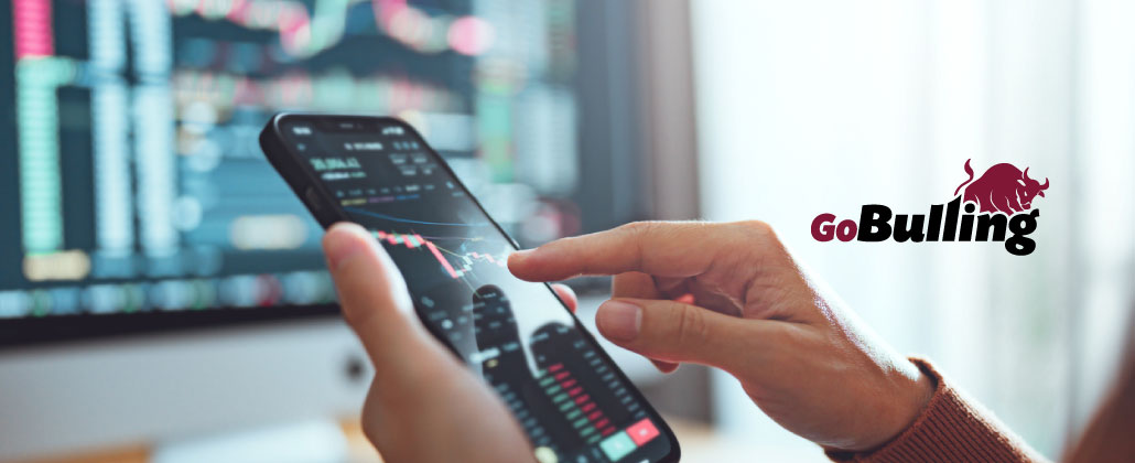 Investidor ao telemóvel faz investimentos na Bolsa através da GoBullying.